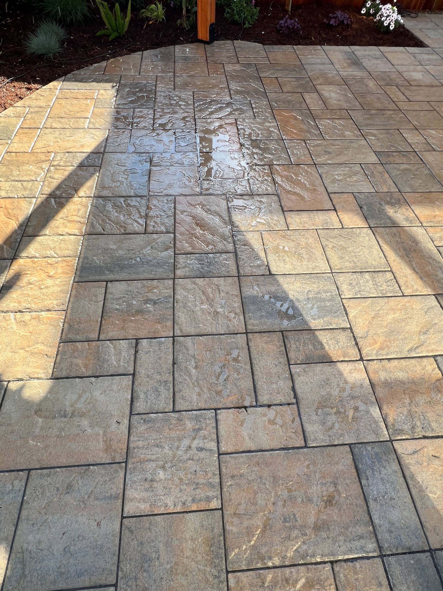 Completed multicolor paver patio installation by RJ Landscape